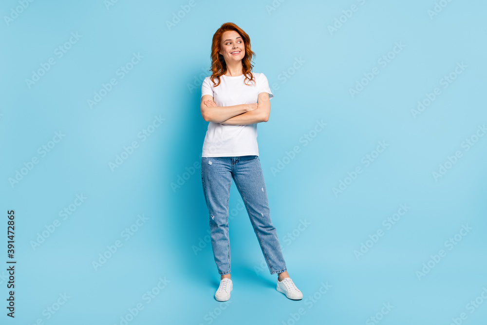 Photo portrait full body view of confident girl with crossed arms looking to side isolated on pastel blue colored background - obrazy, fototapety, plakaty 
