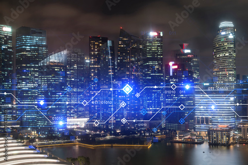 Information flow hologram, night panorama city view of Singapore. The largest technological center in Asia. The concept of programming science. Double exposure.