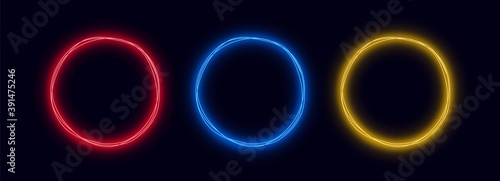 Neon circles set isolated on dark background. Conceptual glowing round shapes for graphic design.