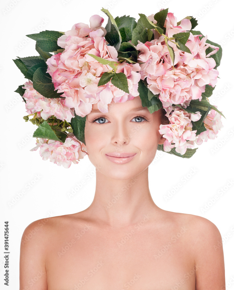 fashion model with large hairstyle and flowers in her hair. fashion model with large hairstyle and flowers in her hair.