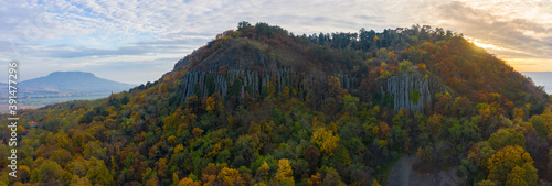 Kisapati, Hungary - Aerial panoramic view of volcanic basalt organs at Szent Gyorgy-hegy with moody tones, warm autumn colored trees. photo