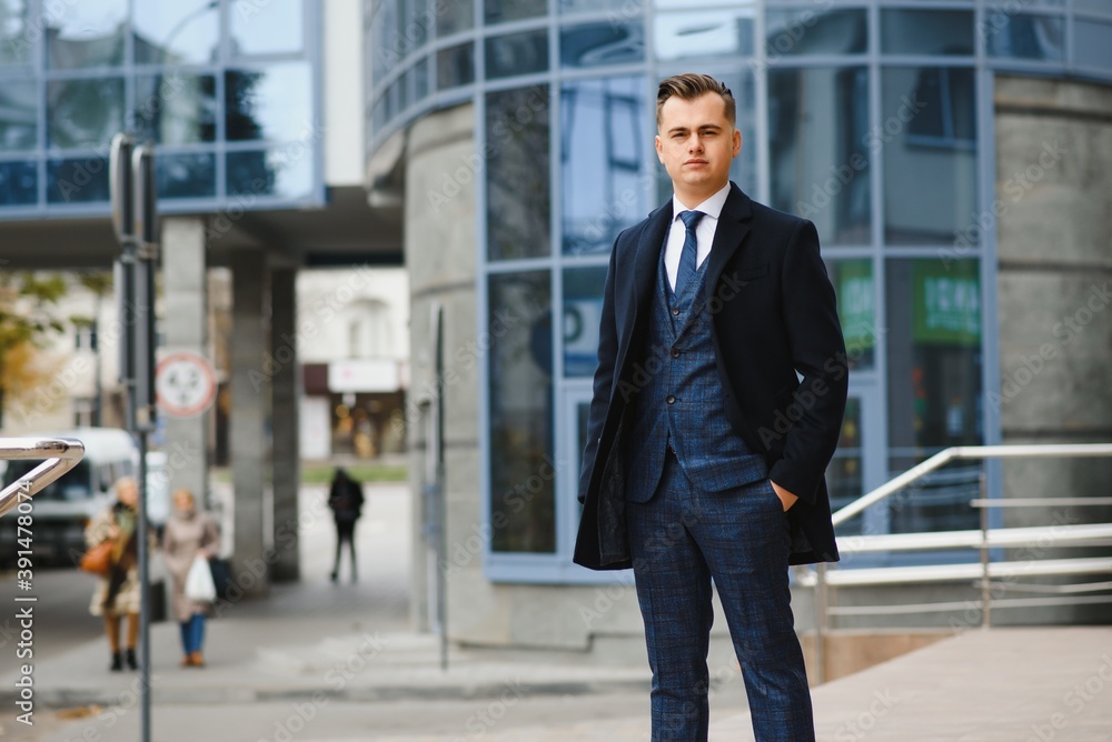 Fashion shot of a handsome young man in elegant classic suit. Men's beauty, fashion. Fashion shot of a handsome young man in elegant classic suit. Men's beauty, fashion.