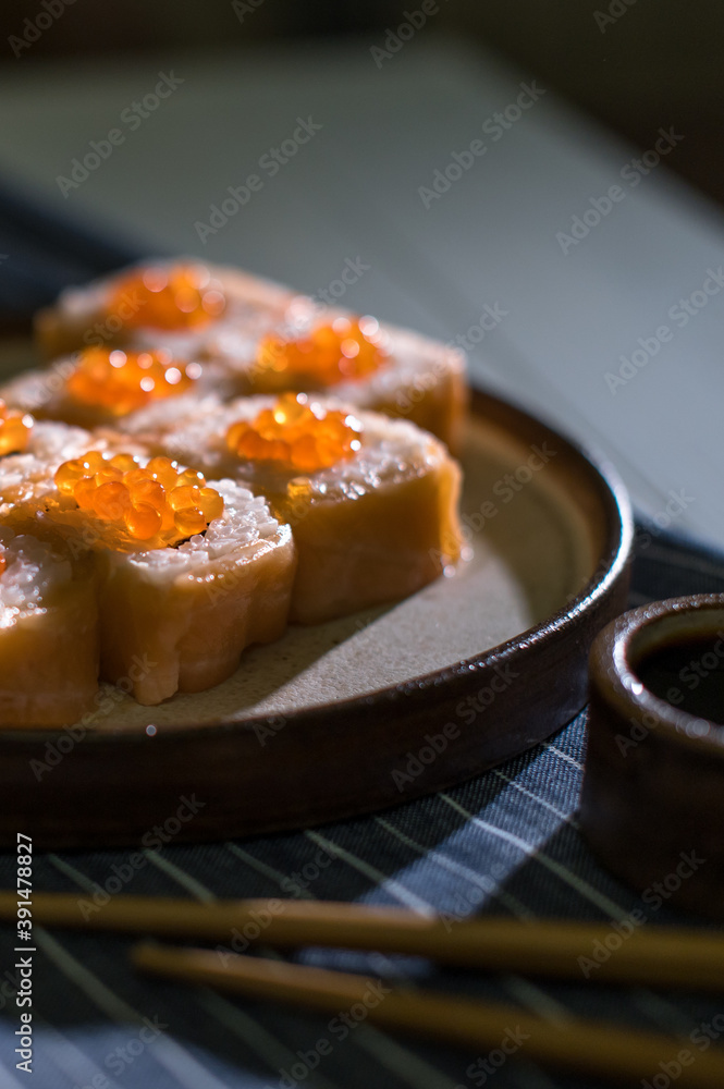 Sushi roll Philadelphia with salmon and caviar