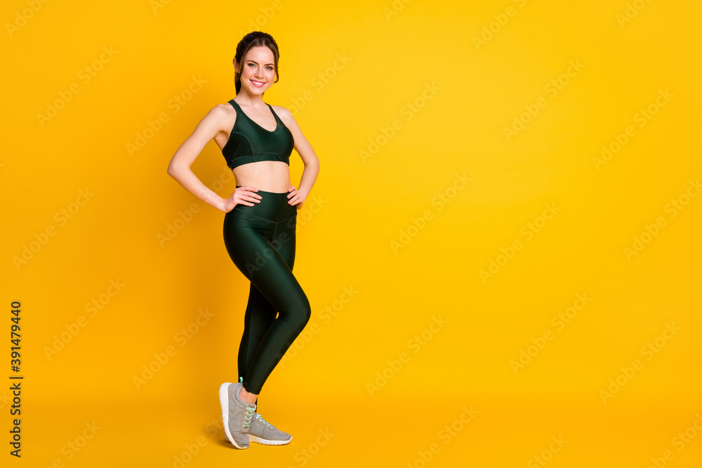 Full length body size view of her she nice attractive cheery slender girl model posing isolated over vibrant yellow color background