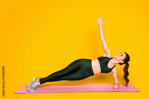 Full body size view of nice attractive sportive cheerful girl instructor working out fat burning isolated on bright yellow color background