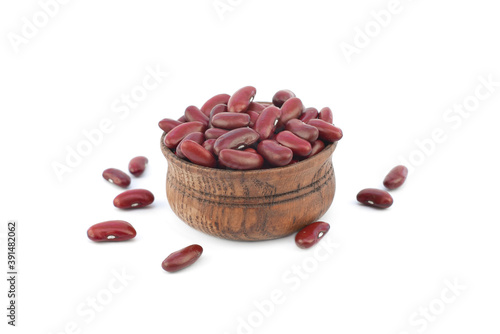 Red kidney beans. Raw food in a small wooden bowl