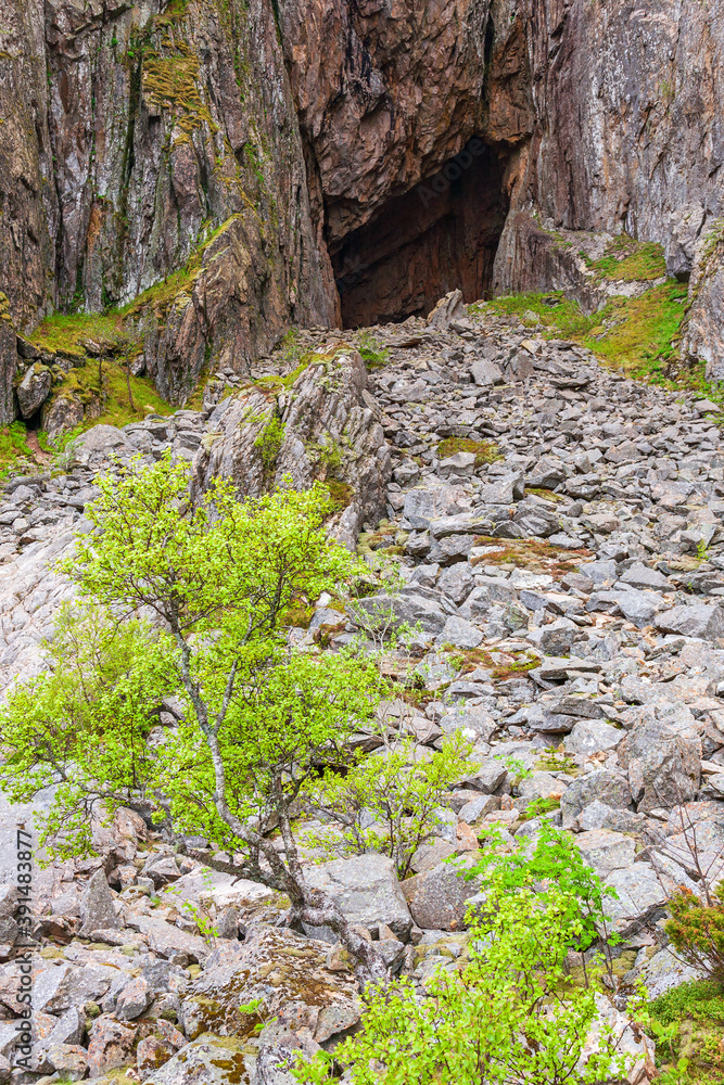Rock cave with a scree of rocks Rock cave with a scree of rocks