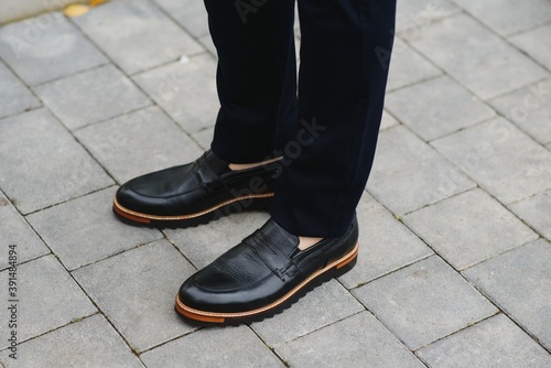 Male elegant shoes and trousers. © Serhii