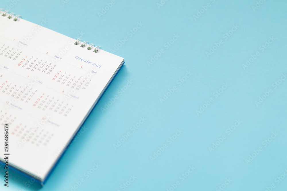2021 calendar page on blue background business planning appointment meeting concept 2021 calendar page on blue background business planning appointment meeting concept