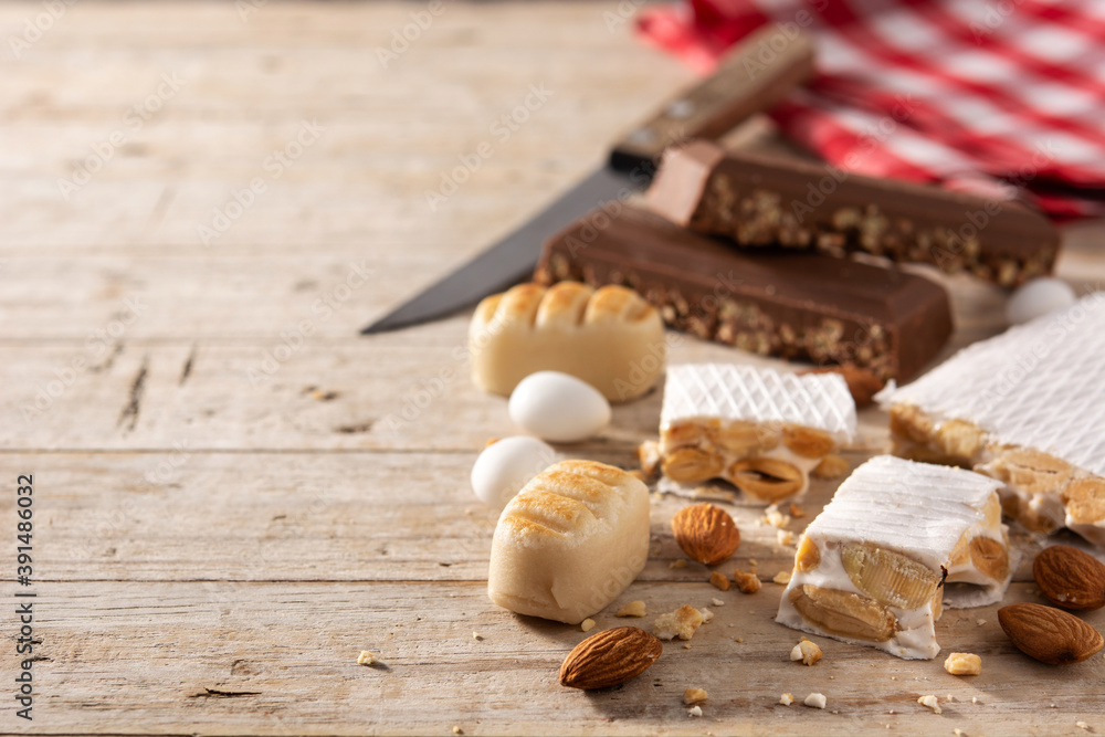 Assortment of Christmas nougat on wooden background. Copy space Assortment of Christmas nougat on wooden background. Copy space