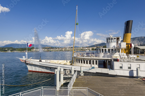 vintage steamboat moored on a pier on Lake Geneva in Geneva Switzerland. photo