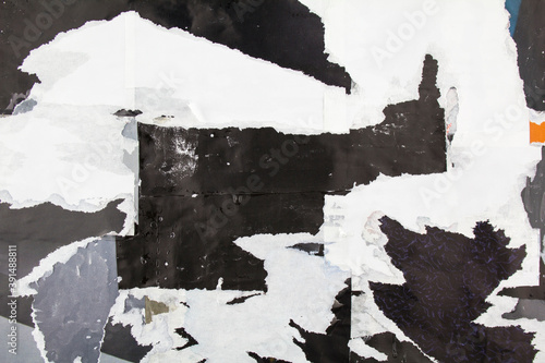 Torn and crumpled dirty paper posters. Abstract background with ripped pieces of magazine paper.