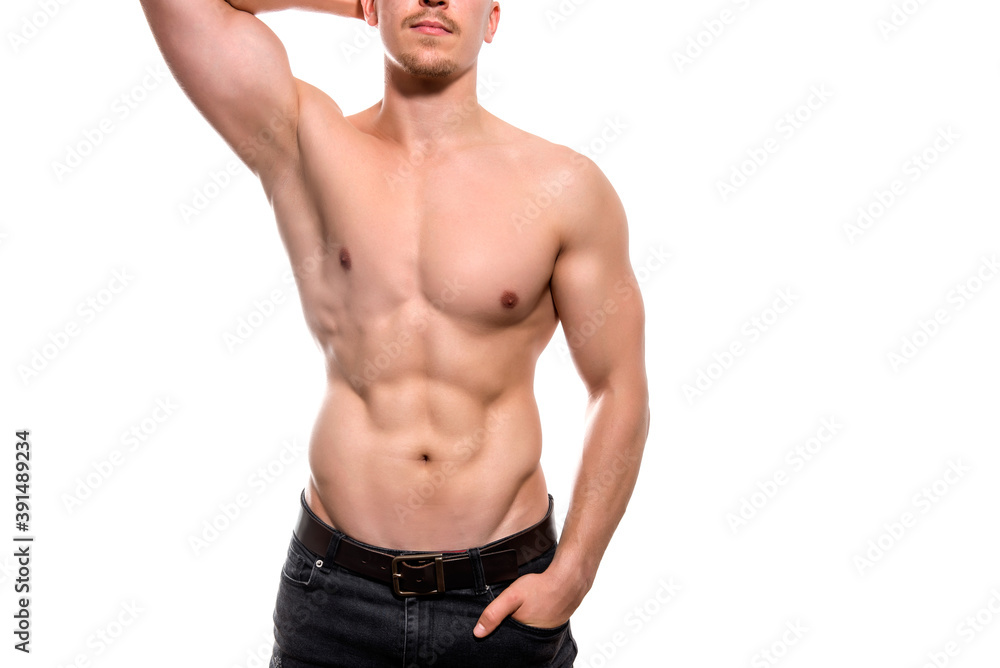 Muscular male torso of fit bodybuilder isolated on white Muscular male torso of fit bodybuilder isolated on white