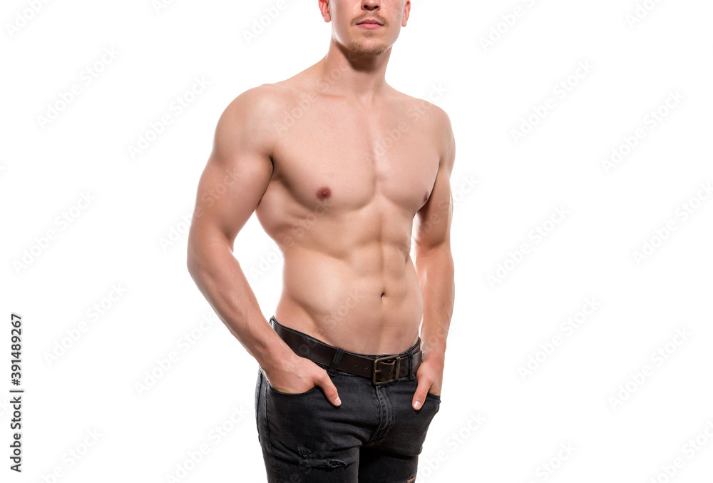 Muscular male torso of fit bodybuilder isolated on white Muscular male torso of fit bodybuilder isolated on white