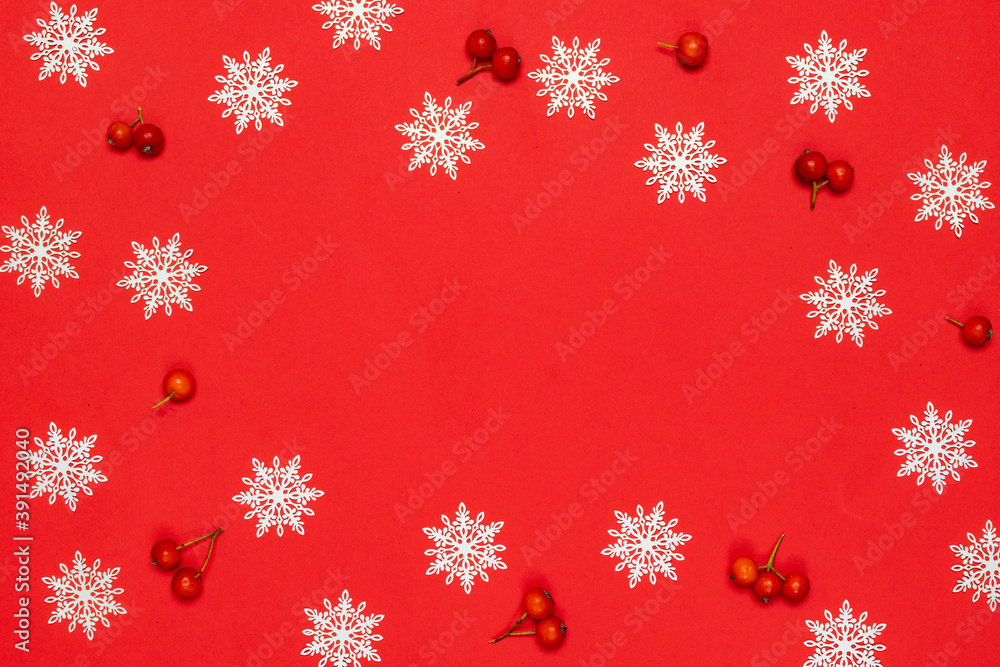 Winter banner. Red berry, white snowflakes in shape frame on red background for greeting card. Christmas, winter, new year concept. Winter banner. Red berry, white snowflakes in shape frame on red background for greeting card. Christmas, winter, new year concept.