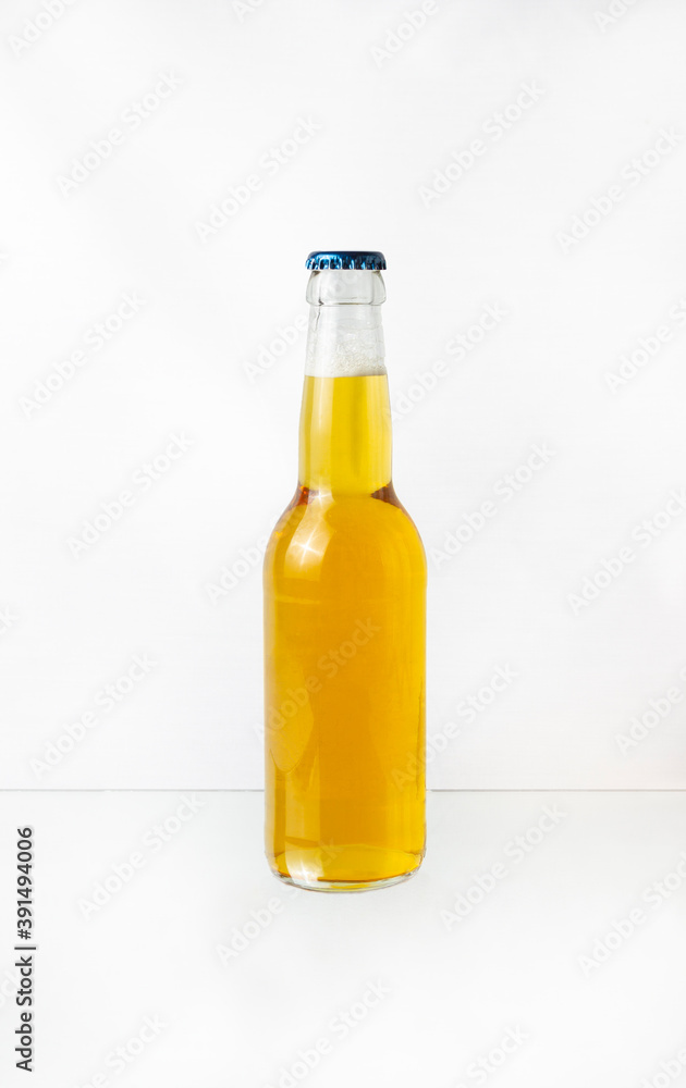 a transparent bottle of beer isolated on white background a transparent bottle of beer isolated on white background
