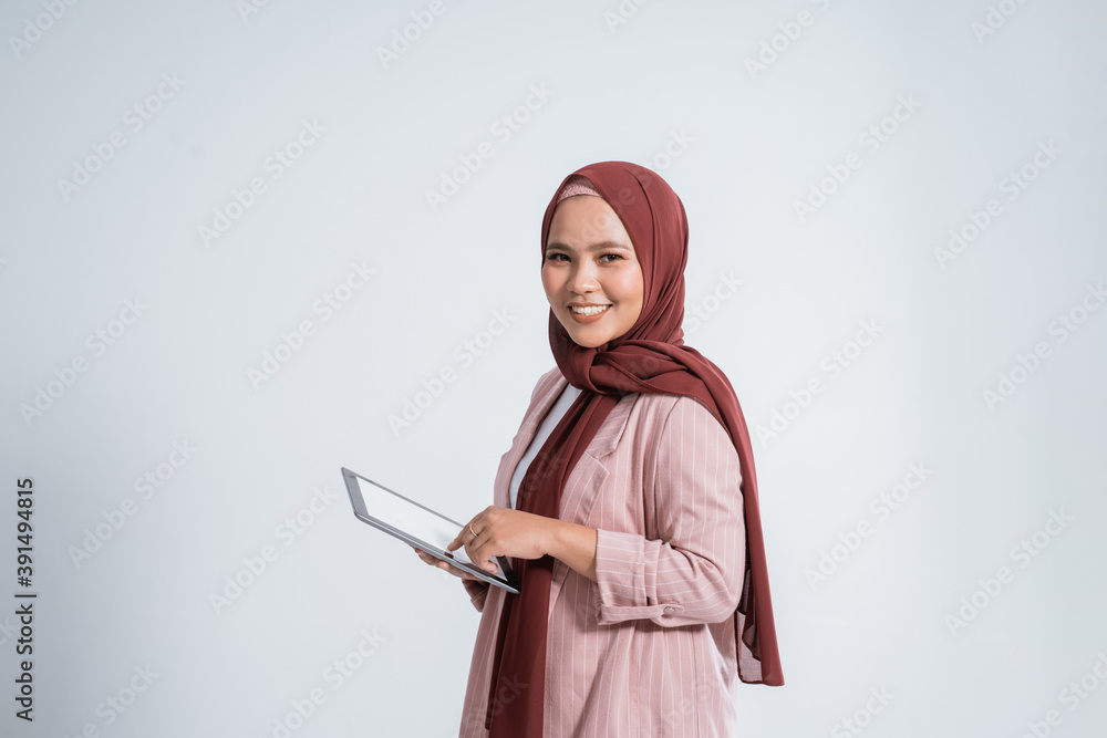 Happy business muslim woman portrait using the tablet Happy business muslim woman portrait using the tablet