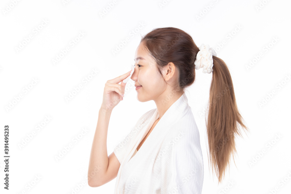 Attractive beauty young asian woman clean skin with cotton pad removing make up on white background. Attractive beauty young asian woman clean skin with cotton pad removing make up on white background.