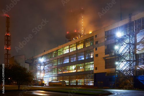 Petrochemical plant in night. Urea Granulation Tower fertilizer granulator prilling high-tower complex. Long exposure photography. photo