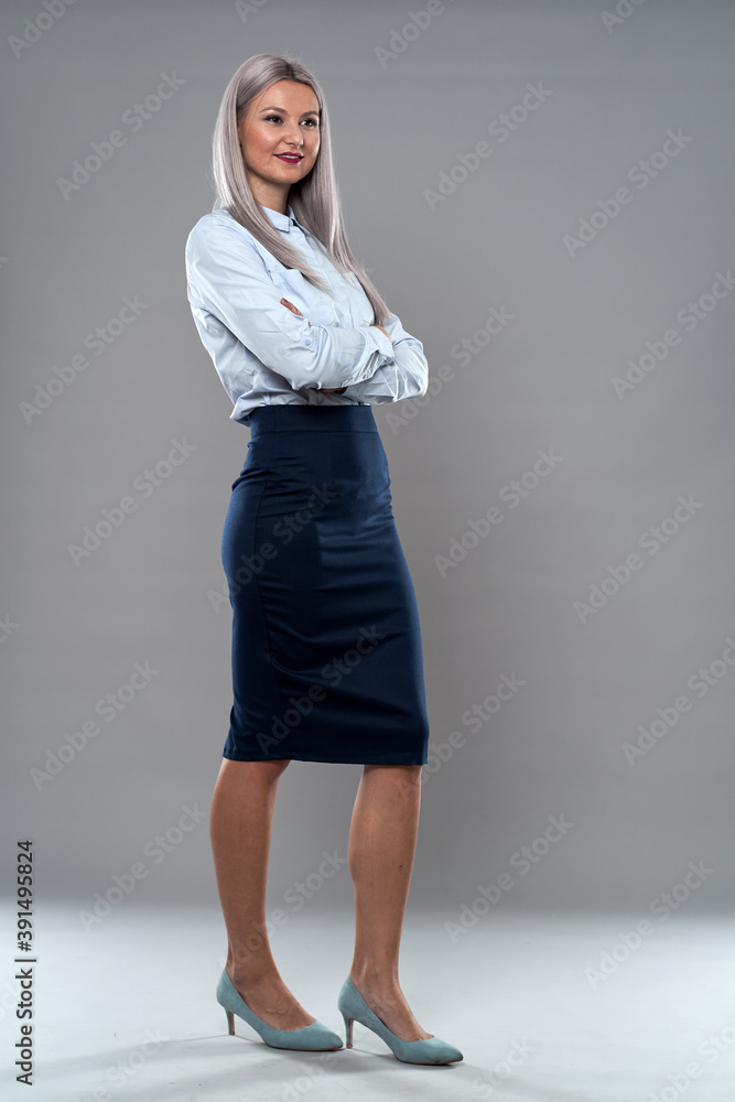 Successful businesswoman on gray Successful businesswoman on gray