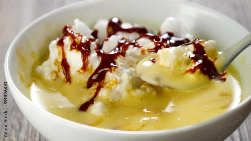 floating island dessert and spoon eating floating island dessert and spoon eating