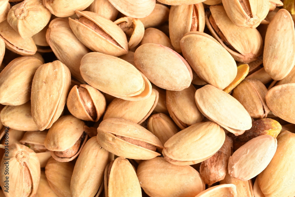 Organic salted delicious pistachios, close-up.