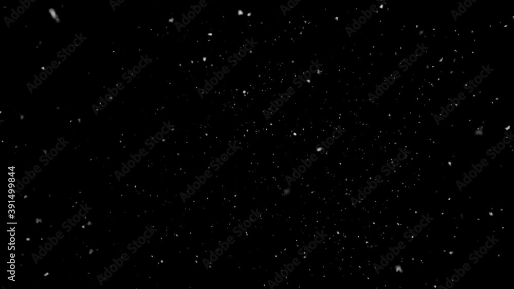 snow fall concept. Falling raindrops or snow against a black background snow fall concept. Falling raindrops or snow against a black background