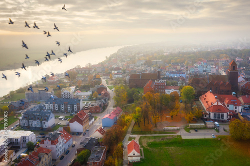 Aerial landscape of misty Tczew city over the Vistula river, Poland.