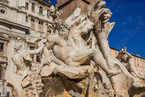 Ganges, Danube and Nile statues from wonderful baroque Fountain of Four River in Piazza Navona Square designed by famous artist Bernini (17th century)