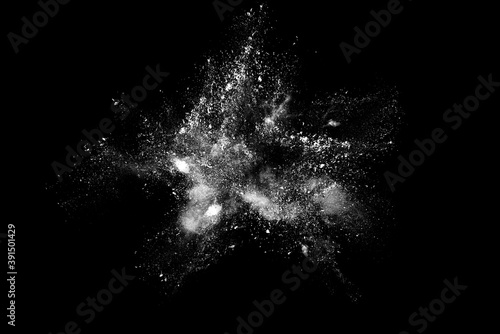 White powder explosion isolated on black background.