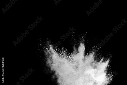 White powder explosion isolated on black background.