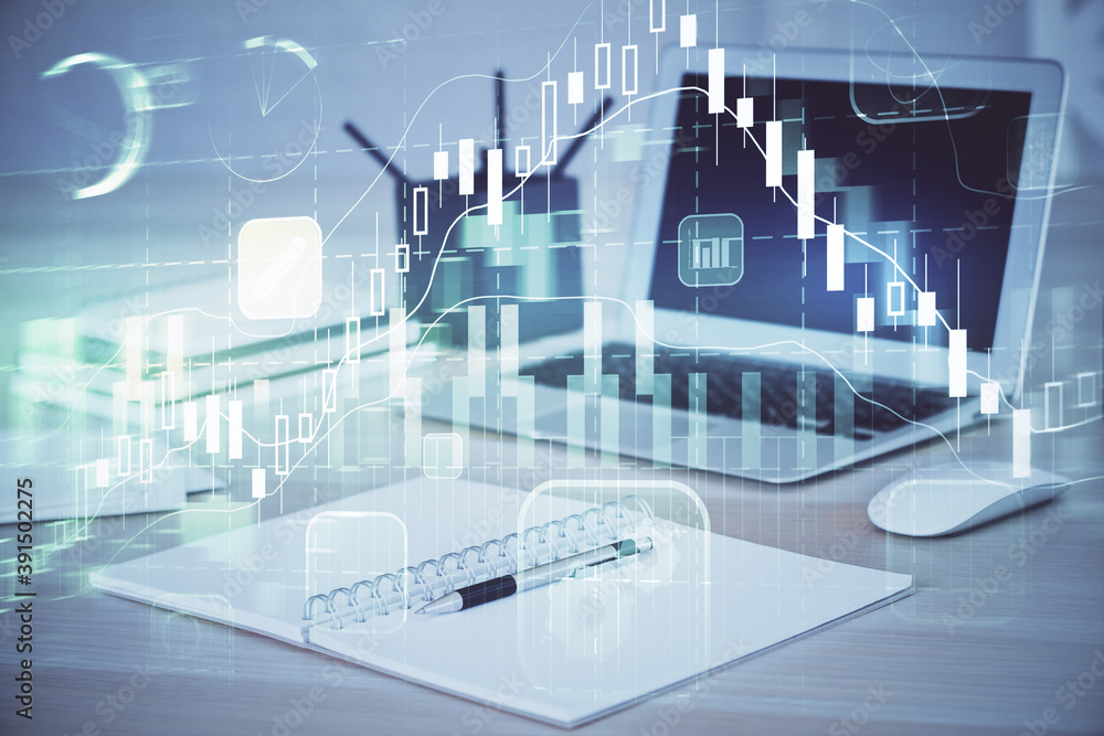 Fototapeta premium Stock market graph on background with desk and personal computer. Multi exposure. Concept of financial analysis.