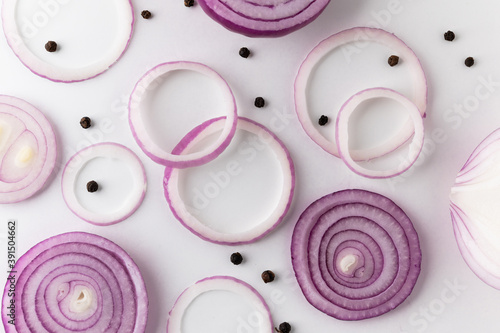 Red onion Sliced in different ways and arranging with black pepper. Top view Garnish and food ingredients on isolated white background.