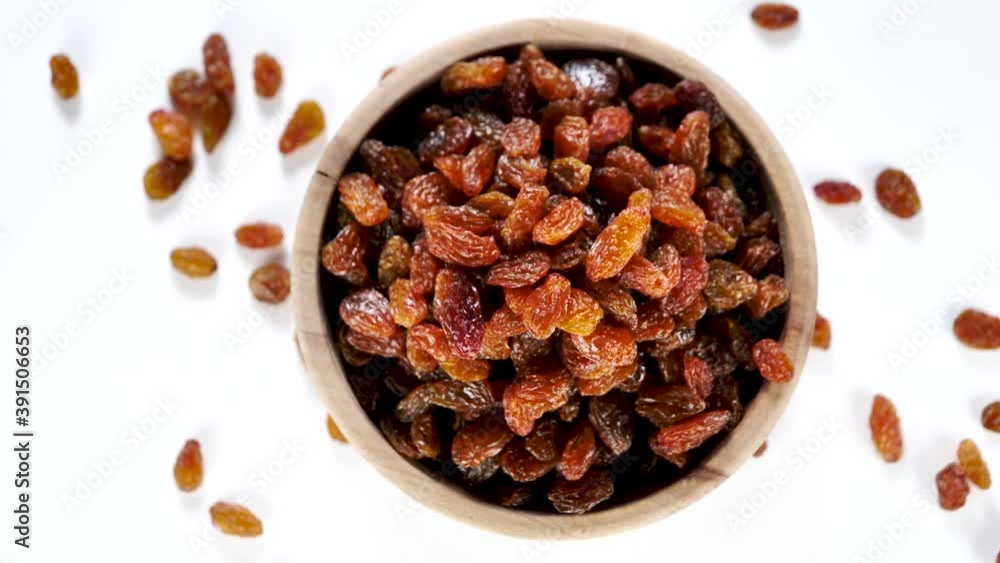 bowl of raisin rotating on white background bowl of raisin rotating on white background
