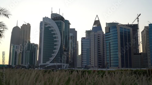 Doha, Qatar- 03 November 2020 :The skyline of Qatar city during sunset with gloomy sky . moving shot photo