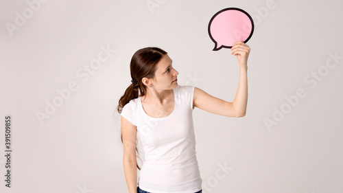 woman holding blank speech bubble © Аркадий Коробка