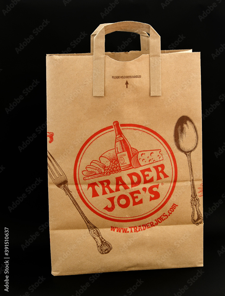 Brown paper bag from Trader Joe s grocery store against black background. Stock Foto Adobe Stock