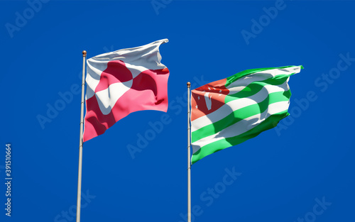 Beautiful national state flags of Greenland and Abkhazia. © Leo Altman