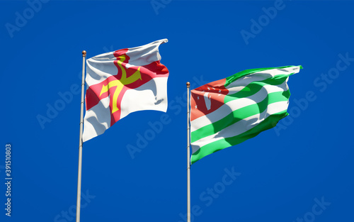 Beautiful national state flags of Guernsey and Abkhazia.