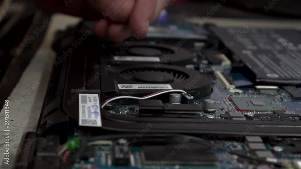 disassembling a laptop in a service center disassembling a laptop in a service center