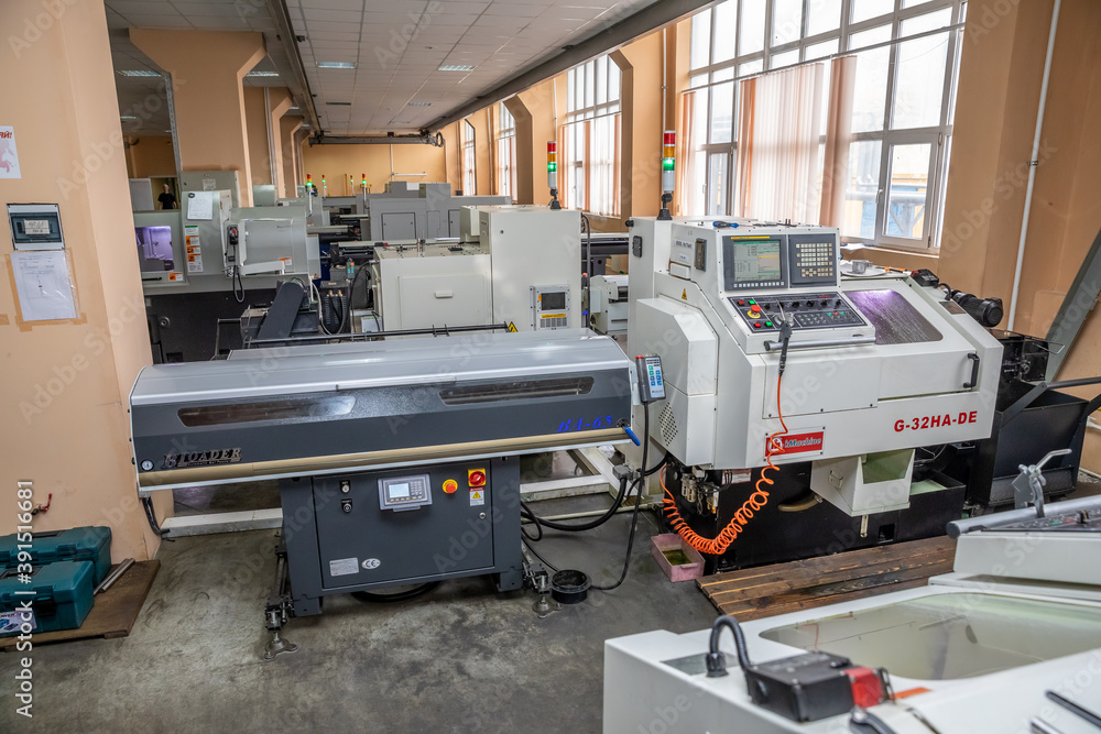 a number of CNC machines in the production room. Interior of industrial premises a number of CNC machines in the production room. Interior of industrial premises