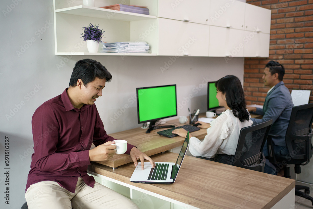 Portrait of coworkers who are busy working according to their respective places. in the office