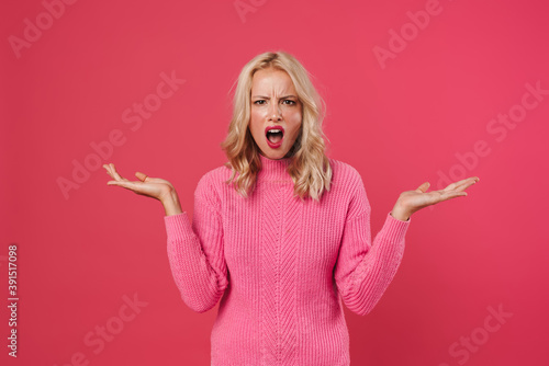 Foto Confused upset shrugging shoulders isolated