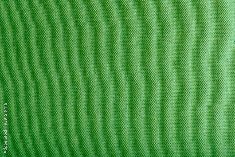 Fototapeta premium Texture of green cardboard or thick pressed cardboard as a background.