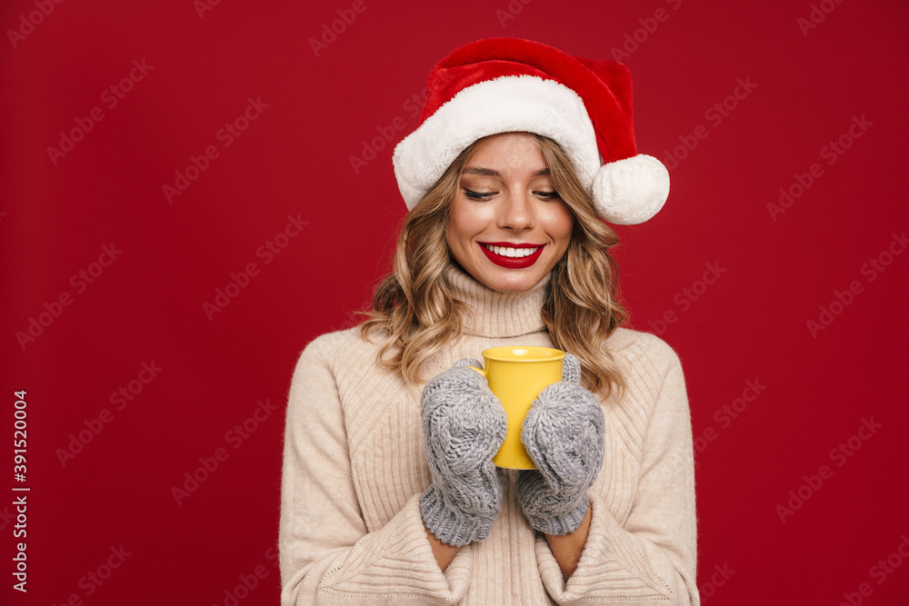 Beautiful young woman wearing santa hat Beautiful young woman wearing santa hat