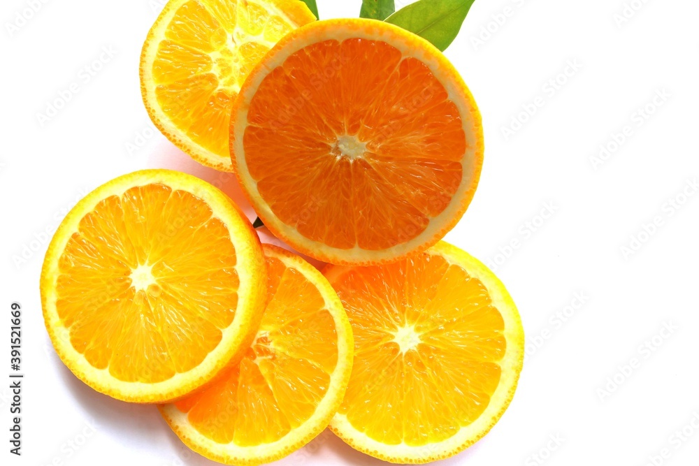 Orange fruit piece slices with green leaves fruits or vegetables isolated on white background closeup. Orange fruit piece slices with green leaves fruits or vegetables isolated on white background closeup.