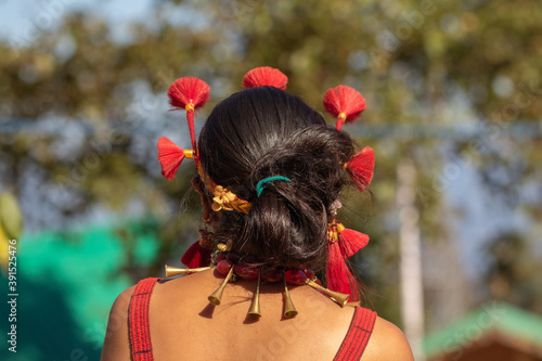 Selective focus Abstract image of a traditional tribal Naga women from back wearing a traditional headgear  photo