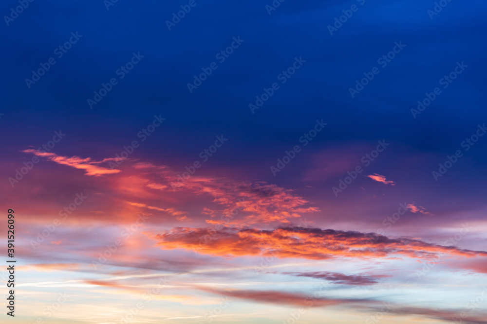 Beautiful blue evening sky with pink clouds from the setting sun