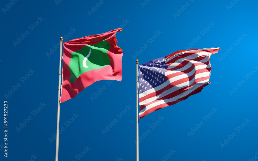 Beautiful national state flags of Maldives and USA together at the sky background. 3D artwork concept. Beautiful national state flags of Maldives and USA together at the sky background. 3D artwork concept.