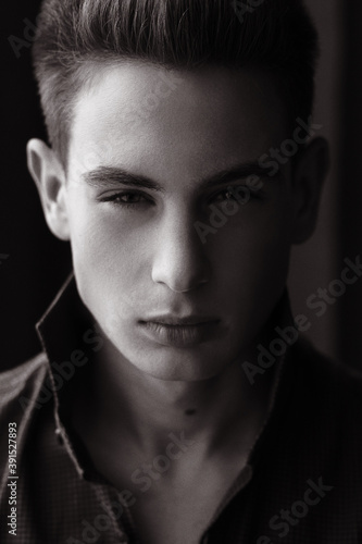 Portrait of a stylish handsome muscular young man. © Valentinka